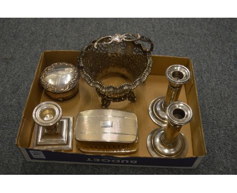 A collection of silverware and plated items to include swing handle basket frame, pair of candlesticks, another candlestick e