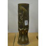 Trench Art, an embossed brass shell case depicting a woman gathering grapes.