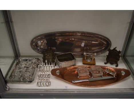 A quantity of plated items to include a stylish nut cracker, toast racks, asparagus dish and tongs etc.