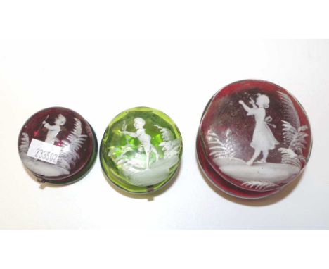 Three antique Mary Gregory glass trinket boxes all with figural decoration, two ruby glass and one green glass, width 7cm app