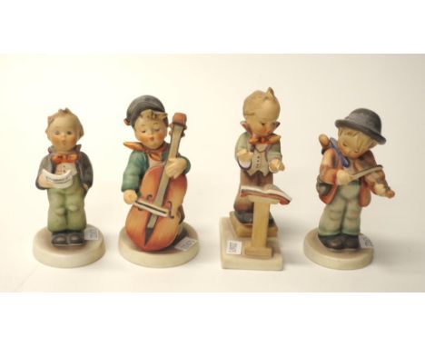 Four Hummel West German figurines comprising one boy conducting, one boy playing the violin, one boy playing a cello, and the