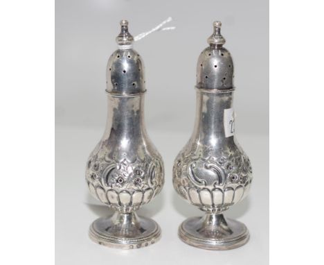 Pair of sterling silver salt &amp; pepper shakers hallmarked Birmingham 1890, maker: Hayes Brothers, with embossed decoration