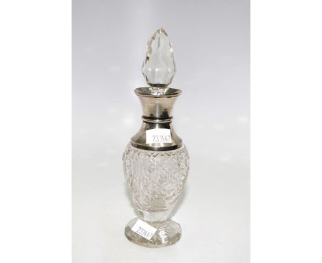 Sterling silver and cut crystal perfume bottle hallmarked Birmingham 1909, makers mark rubbed (chips to stopper)