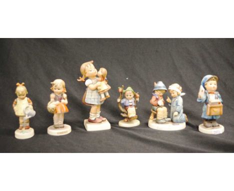 Six various M J Hummel figures to include Postman, girl &amp; doll, doctors and nurses, boy in apple tree, girl with basket, 