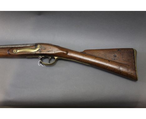A Brown Bess military musket, 38 1/2" barrel stamped "GR" below a crown with a broad arrow below, flintlock and ramrod missin