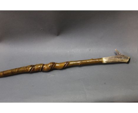 A red stag antlered walking stick, with honeysuckle twist shaft, 126 cm.