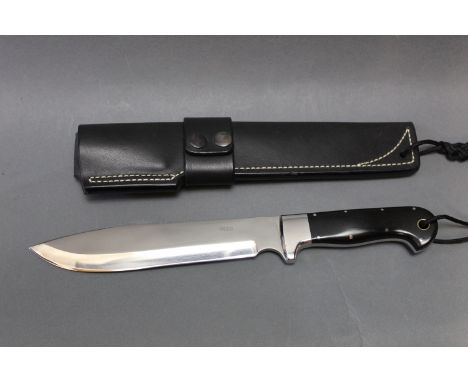 Alan Wood a fixed blade drop point camp knife, with 8" blade and stainless steel handle with black micarta scales.  Overall l