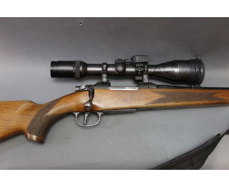 A CZ Cal 243 bolt action rifle, with trap door magazine, fitted with a Swarovski Habicht 3-12 x 50 telescopic sight, and a sl