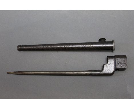 An Enfield No 4 Mk2 bayonet with sheath, stamped with a broad arrow.