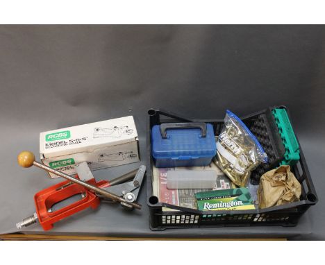 A reloading kit, to include press, RCBS reloading scale, 243 brass cases etc.