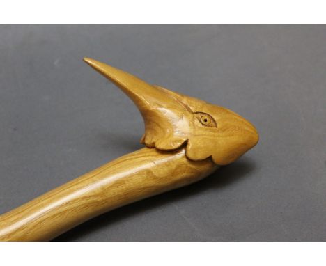 A hazel shafted walking stick with carved wooden handle in the form of a pheasants head, length 116 cm.