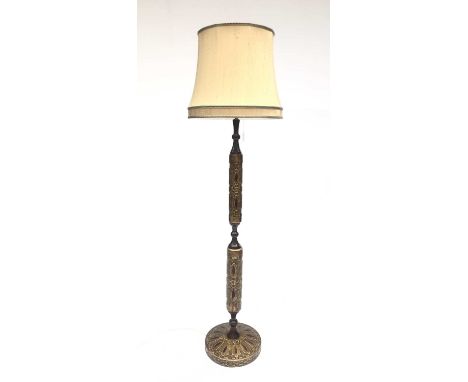 A mid century turned wood and composition standard lamp, with green and gilt painted decoration, with shade. Overall height 1