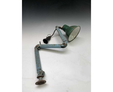 A mid century adjustable workshop lamp, with green enamelled shade, maximum length 80cm.