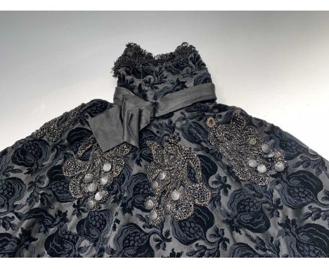 Two fine black Victorian capes, one in a cut velvet of pomegranite design with deep lace trim heavily embelished with jet bea