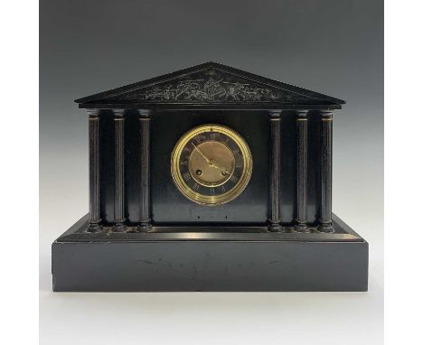 A late 19th century black slate mantel clock, the architectural case with cast classical metal apex and six columns, height 3