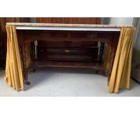 A late Victorian walnut washstand/dressing table, stamped Shoolbred & Co, fitted two fluted drawers with a lower shelf, on tu