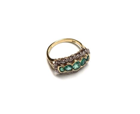 A post-war 18ct gold ring set with five emeralds within a band of diamonds