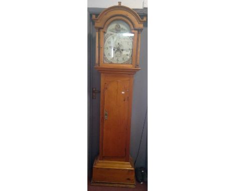 A Victorian pine eight day longcase clock, the painted arch dial signed W Coulson, Helston, the arched hood with plain column