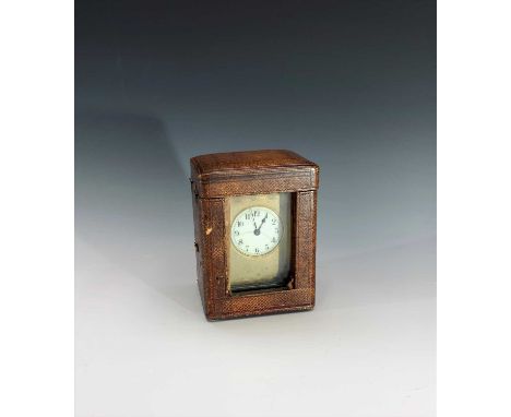 A late 19th century French carriage timepiece, white circular enamel dial with frosted gilt mask, in original carrying case. 