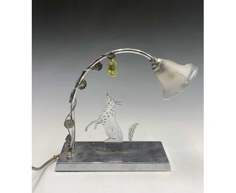 A 1930s French Art Deco chrome table lamp, modeled as a fox reaching in vain for a bunch of ripe grapes thus telling the fabl