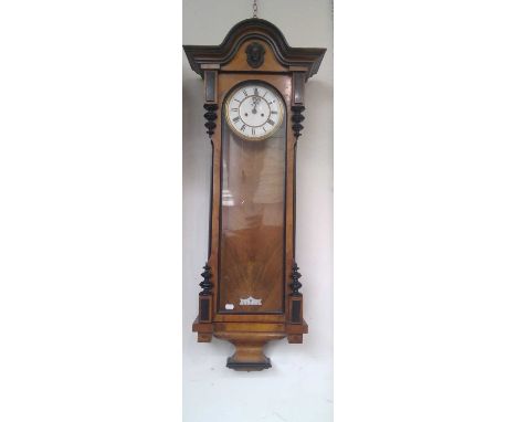 A walnut and ebonised Vienna regulator type wall clock, late 19th century, with white enamel dial and twin weight movement, h