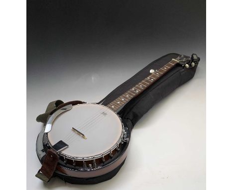 A Stagg five string Banjo, in soft case length 96cm. Condition report: This modern instrument is in very good condition. It h