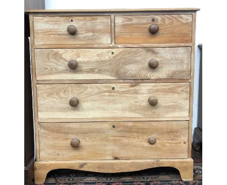 A pine chest of drawers, with two short and three long drawers, on bracket feet, height 100cm, width 93.5cm.