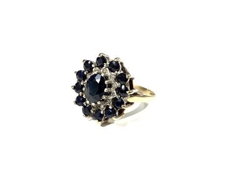 A 9ct gold cluster ring set blue and white stones