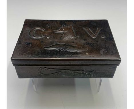 Hunting Interest: A Newlyn copper cigarette box, the cover embossed with a fox mask and brush betwixt the initials C.V., the 