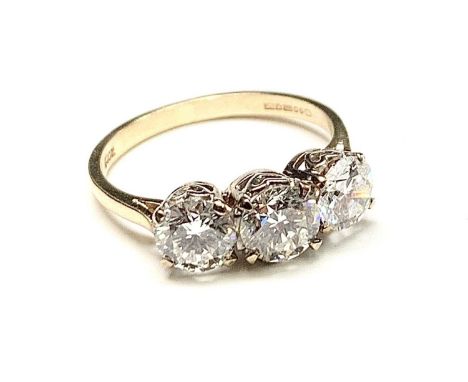 A good three stone diamond ring totaling approx 1.75cts spread each near flawless and colourless stone is well cut and lively
