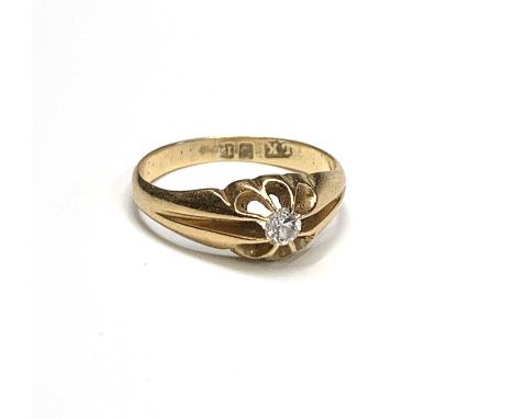 An 18ct gold ring, gypsy set a diamond