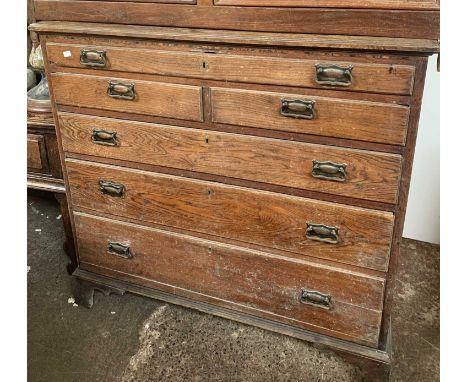 A late George III country made elm chest of drawers, fitted with an arrangement of two short and four long drawers, with a ch