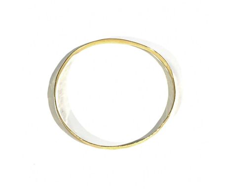 Breon O'CASEY (1928-2011)An 18ct gold bangle the band 4.5mm wide and slightly concave with texturing and 60mm diameterHallmar