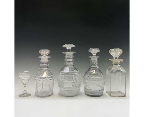 A Regency triple ring neck decanter and stopper, with fine engraving, height 22.5cm, together with three other decanters and 