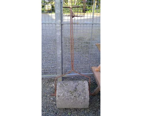 A wrought iron and concrete garden roller. Width of roller 44cm.