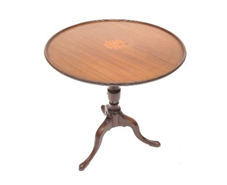 A late George III mahogany circular occasional table, with shell and flower inlay, chequer banded edge and raised on a vase t