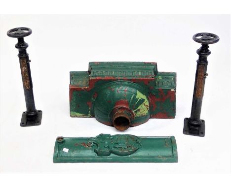 A large cast iron rainwater hopper, height 33cm, width 61cm and a cast iron lamp post door ,with a coat of arms, height 57.5c