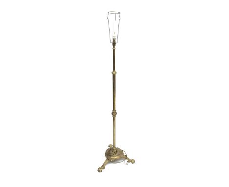 A brass standard lamp, tripod feet. 156cm