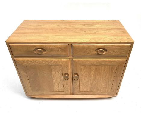 An Ercol light elm side cabinet, late 20th century, with two drawers above two doors with shaped wood handles, height 68cm, w