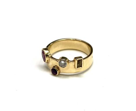 A contemporary18ct gold ring by M&amp;M rubbed collet set with a diamond, a ruby and two other stones