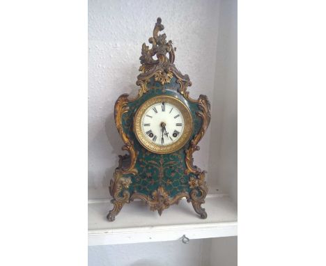 An Ansonia Louis XV style mantel clock, in lacquered and gilt brass case, striking on a coiled gong, height 42cm.