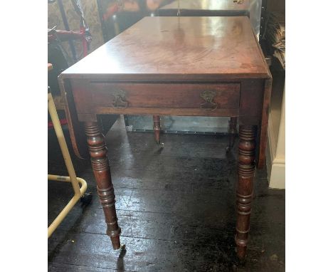 A Victorian mahogany Pembroke table fitted with an end drawer and raised on ring turned legs. Height 73cm, width 91cm, depth 