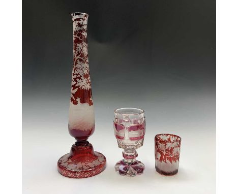 A late 19th century Bohemian ruby overlaid glass goblet, inscribed 'Sovenir of one friend to Boosey' (sic) and further decora