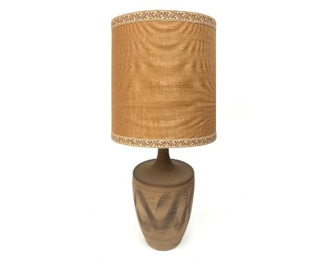 An impressive 1970s pottery table lamp of urn form with incised decoration by David White with hessian shade. Signed to base,