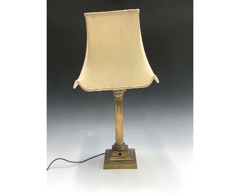 A brass corinthian column lamp base. Height 43cm. 