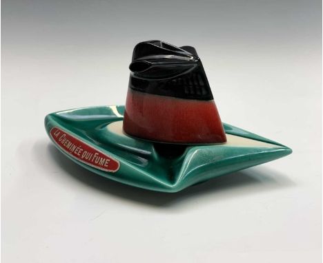 A 1960s SS.France funnel ashtray in the form of a ship, bearing label 'La Cheminee Qui Fume',  in the green colourway. Height