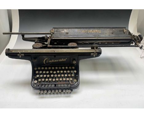 A Continental typewriter, early 20th century, width 68cm.