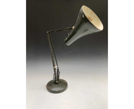 A green painted anglepoise style lamp on circular base, maximum height 79cm.