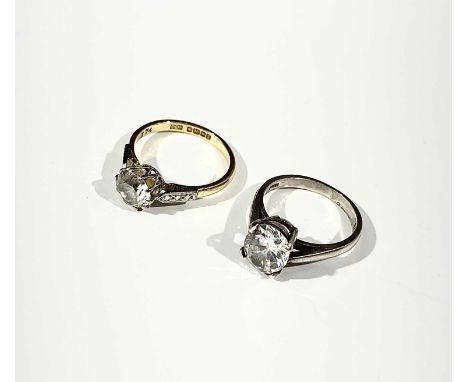 An 18ct ring set a white stone and a silver ring set a white stone