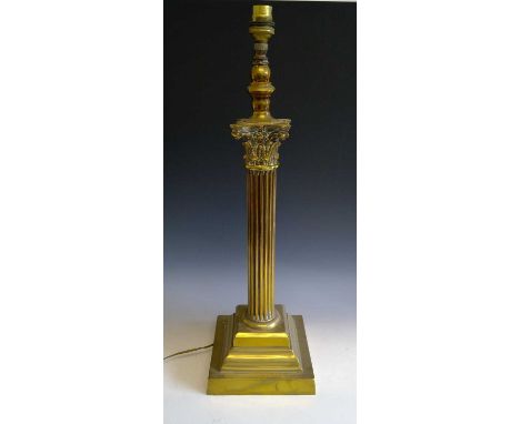 A brass corinthian column lamp base, bearing inscription 'Presented to the Rev. E. A. Cooke M.A. by the Band of Hope of St. J